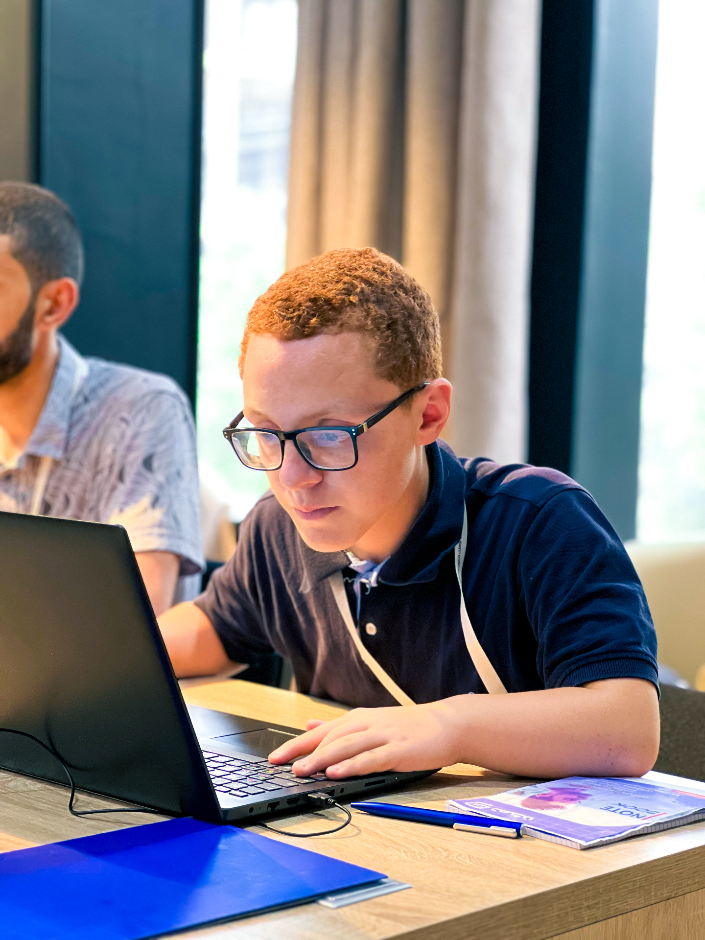 Student focused on laptop